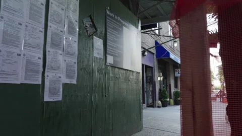 Winding through a green construction scaffolding tunnel iin New York City Stock Footage 242313608