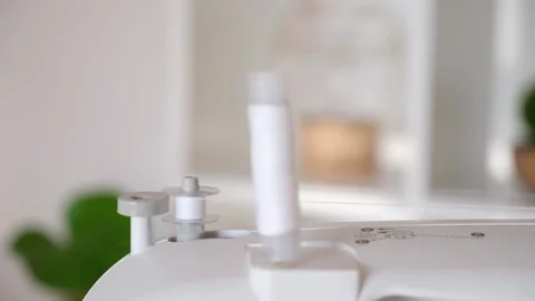 Winding white threads on bobbin sewing machine Stock Footage 201320669