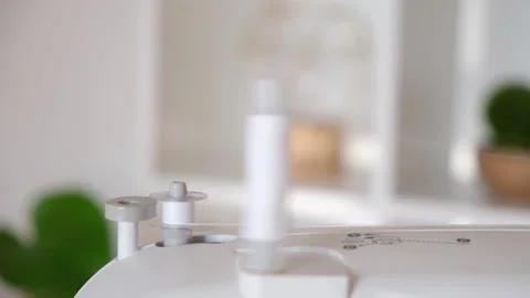 Winding white threads on bobbin sewing machine Stock Footage 201517356