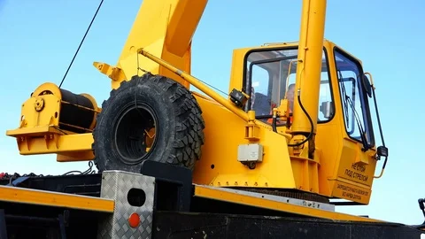 Winding the winch on the drum and turning the cockpit of the truck crane Stock Footage 80475024