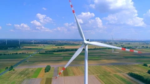 Winding windmill in the field, wind farm, air Stock Footage 78975309
