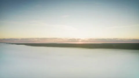 A Windless Dawn. Sun Rays Whimsically Peeking Through Fog Over the River. Aerial Stock Footage 257783181