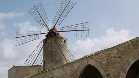 A Windmill against a blue and cloudy sky Stock Footage 255753028