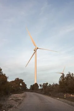 Windmill against cloudless blue sky Stock Photos
