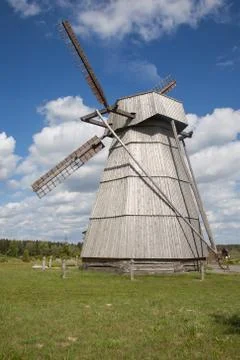 Windmill against cloudy sky Stock Photos
