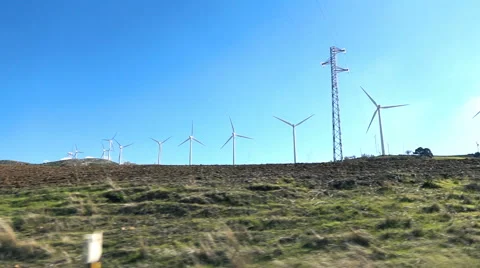 Windmill and blue sky viewed from the car through the country, super slow motion Stock Footage 63607930