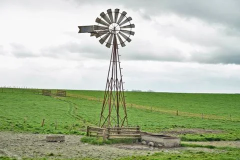 Windmill and cloudy sky Stock Photos