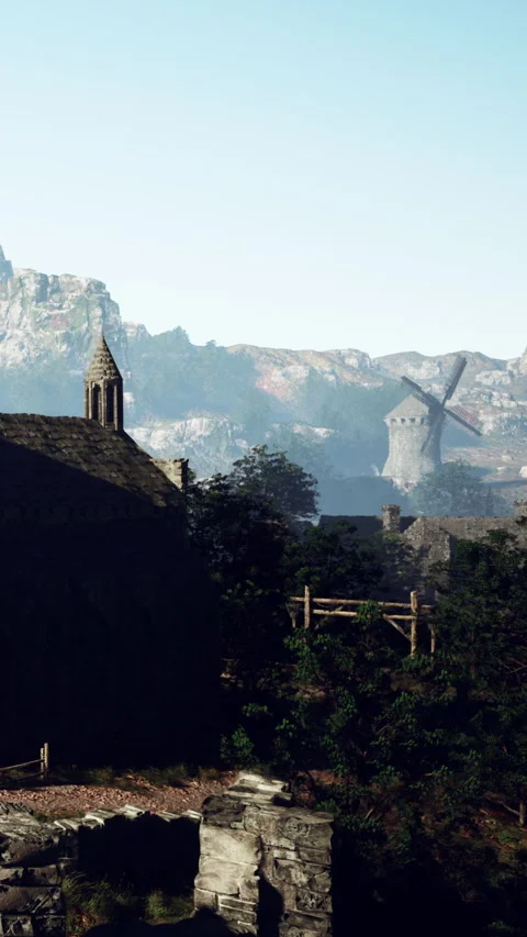 Windmill and old building in a rural area with mountains in the background Stock Footage 337973275
