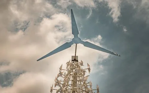 Windmill and paper windmills for decorate in public park and sky landscape. Stock Photos