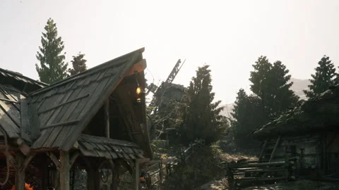 Windmill and rustic buildings in a mountain landscape during the day Stock Footage 345063002
