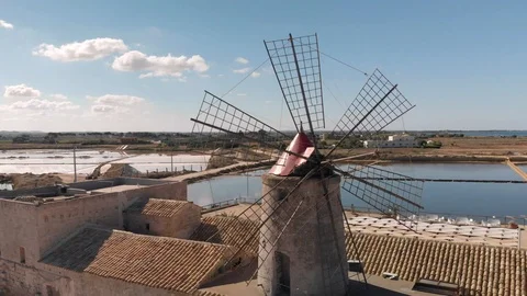 Windmill and saltworks Stock Footage 100464376