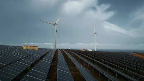 Windmill and solar panel farm producing renewable energy with wind and sun Stock Footage 244803626