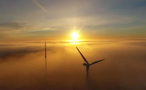 Windmill and sunrise Stock Photos