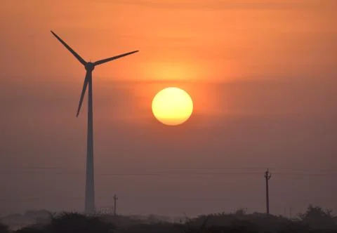 Windmill and Sunrise Stock Photos