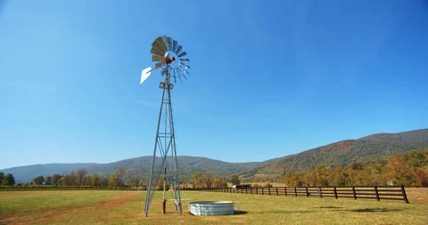 Windmill on Beautiful Farm Landscape, Rolling Green Hills, 4K Stock Footage 120927436