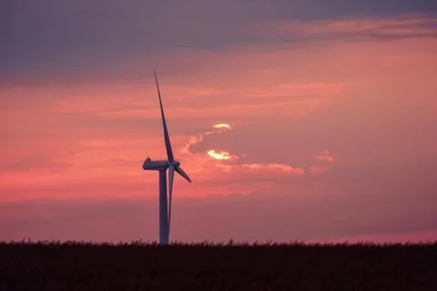 Windmill in a beautiful violet sunset Stock Photos