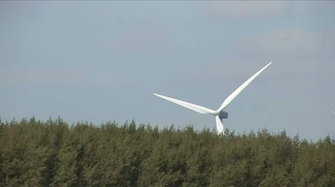 Windmill behind a forest Stock Footage 5700985