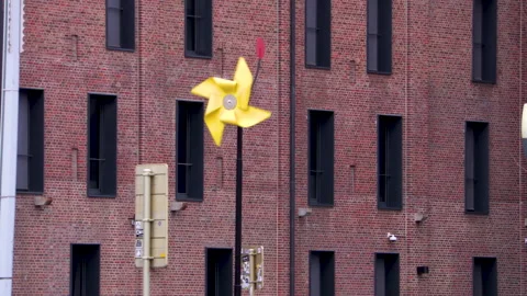 Windmill blowing in the wind by the canal du brussels Stock Footage 142723594