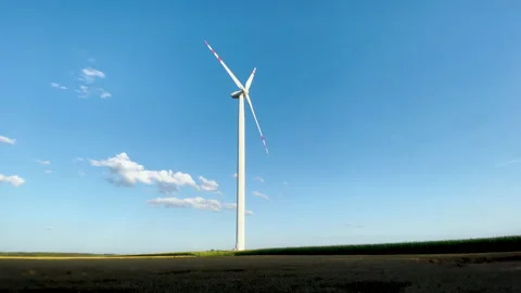 Windmill on blue sky background, generation of electricity from wind energy. 库存影片 235627792