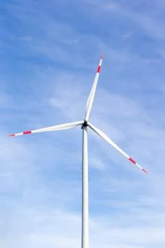 A windmill with a blue sky in the background Stock Photos