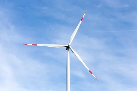 A windmill with a blue sky in the background Stock Photos