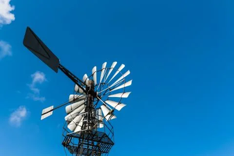 Windmill in blue sky Stock Photos
