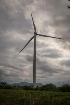 Windmill with cloudy background Stock Photos