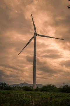 Windmill with cloudy background Stock Photos