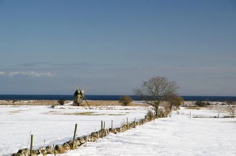 Windmill at coast Stock Photos
