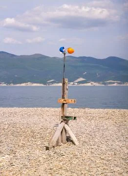 A windmill of construction helmets on the beach Stock Photos