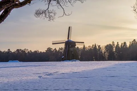 Windmill Covered with Snow at Sunset Stock Photos