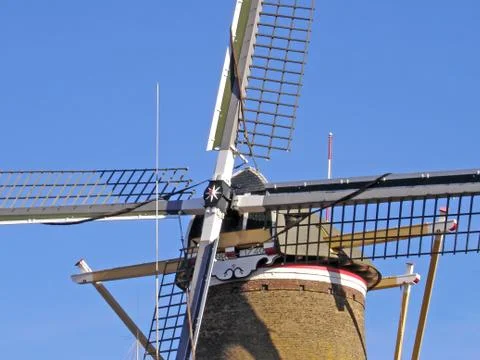 Windmill cross with stacked sails Stock Photos
