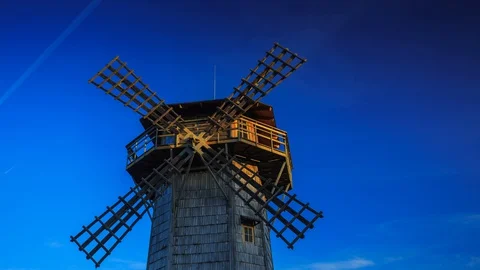 Windmill at dawn. Shadows and rays of the sun creep across the building. Stock Footage 128535762