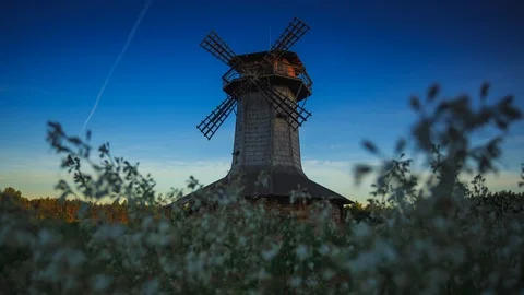 Windmill at dawn. Shadows and rays of the sun creep across the building. Stock Footage 128535956