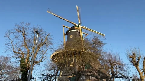 Windmill de Windhond is a historical feature of the city of Woerden Stock-Footage 151286401