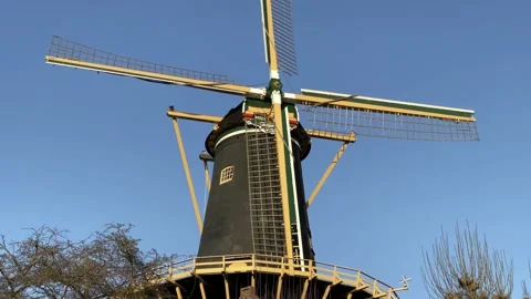 Windmill de Windhond is a historical feature of the city of Woerden Stock-Footage 151286693