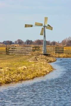 Windmill in dutch fields and meadows Stock Photos