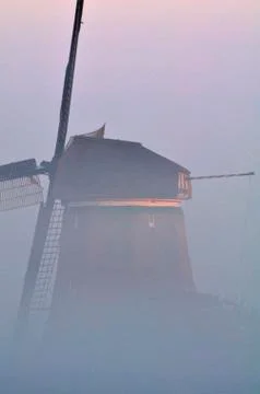 Windmill in Dutch landscape Stock Photos