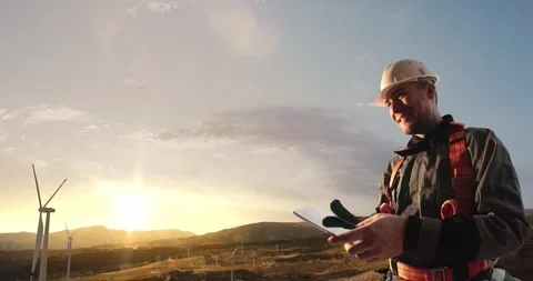 Windmill engineer and businessman planing new ecology project. Stock Footage 141310228