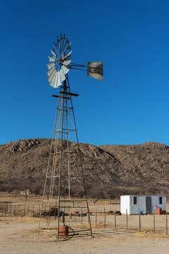 Windmill on a farm in the Erongo Mountains, Namibia Stock Photos