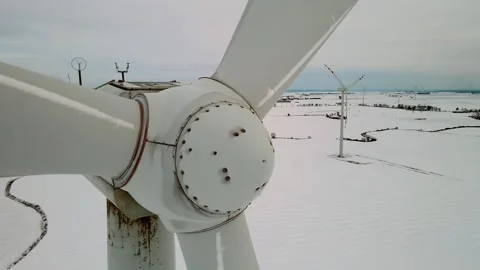 Windmill farm generating green energy. Rotating blades of wind turbines during Stock Footage 268184080