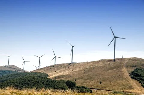 Windmill farm in mountain. Stock Photos