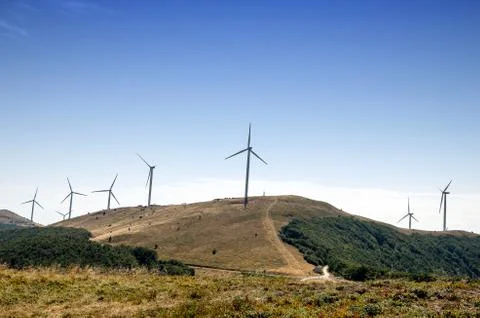 Windmill farm in mountain. Stock Photos