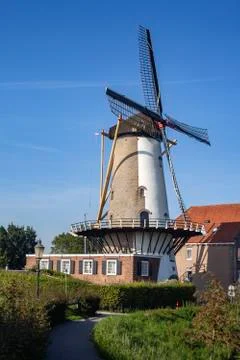 Windmill farm river landscape. Windmill farm scene. Village windmill farm Stock Photos
