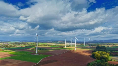 Windmill field against the background of an autumn forest. Orange trees on a Stock Footage 319843288