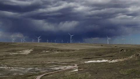 Windmill Field Drone Pan with Approaching Storm 4K Stock Footage 200793657