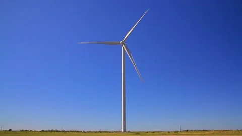 Windmill in a field generates clean electricity with a turbine. Environmentally 스톡 동영상 222417706