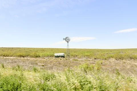 Windmill in a field on the side of the road, in La Pampa, Argentina Foto stock