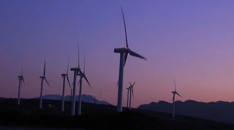 Windmill field in twiglight wide shot Stock Footage 23373733