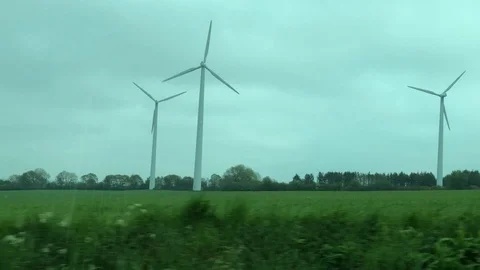Windmill on Fields 4K Driving By Green Energy Climate Environment Stock Footage 114776460